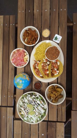 Salad, plantains, taro fries, & seitan tacos!  at Herbivoro in Portland