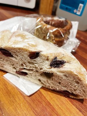 Olive bread and vegan Chelsea cinnamon bun  at The Cheese Room  in Rochester