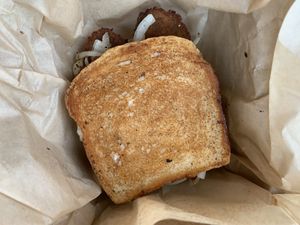 Delish bread, Beyond made into sausage/bacon, cheese, onions, and jam.  DELISH at Healthy Harvest Urban Farms & Cafe in Rock Island