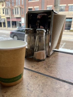 Compostable paper products and pink Himalayan salt shakers  at Healthy Harvest Urban Farms & Cafe in Rock Island