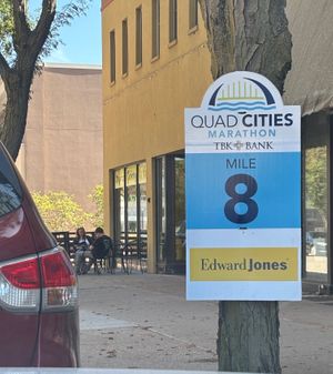 QC Half Marathon signage with Healthy Harvest in the background  at Healthy Harvest Urban Farms & Cafe in Rock Island