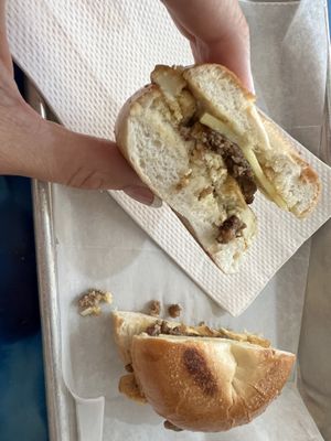 Mini vegan breakfast bagel: all veg butter, crispy sausage, cheese, and tofu egg   at Anaya Coffee in Melbourne