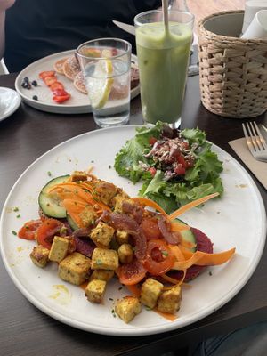 Bread with tofu and pink hummus + iced matcha latte   at Goji Lounge Cafe in Lagos