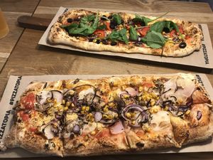 Bottom was whole grain with potato, onion, vegan cheese and corn. at Pizzatopia in Krakow