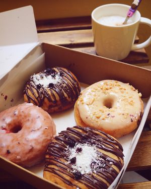 levander, blueberry filled and peanut butter glazed vegan donuts at Donut Shop in Prague