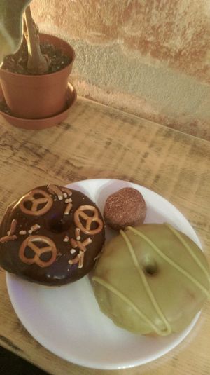 matcha, pretzel with Chocolate and a cinnamon ball  at Donut Shop in Prague