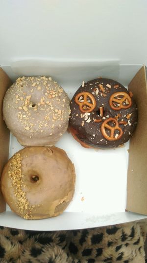 chocolate with pretzels, chai and peanut donuts at Donut Shop in Prague