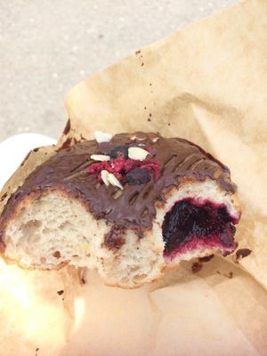 Delicious chocolate donut filled with jam. at Donut Shop in Prague