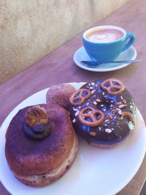 Oat milk cappuccino at Donut Shop in Prague