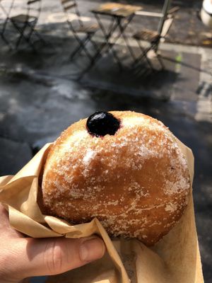 Blueberry jelly filled vegan donut before biting in!  at Donut Shop in Prague