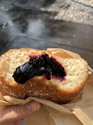 So much luscious blueberry filling in this vegan donut!  at Donut Shop in Prague