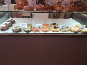 The whole bottom shelf is vegan at Donut Shop in Prague