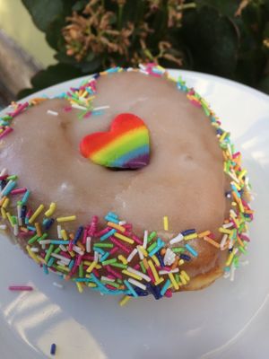 heart-shaped Pride donut, vanilla flavor at Donut Shop in Prague