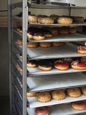 You can see the produce of the donuts at Donut Shop in Prague