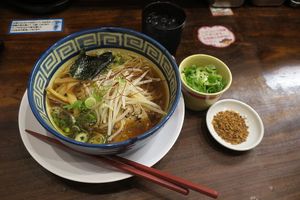 Vegan ramen plus extra spring onions and fried garlic. at Kyushu Jangara Ramen - Harajuku in Tokyo