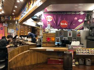 Cozy inside - you pay at the door then take your seat at Kyushu Jangara Ramen - Harajuku in Tokyo