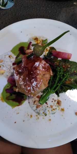 Main plate : Pastille végétale à la patate douce et aux petits légumes avec duo de sauce aux herbes at Annadata in Saint-malo