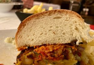 The vegan burger, half eaten already 😁 at Velo Cafe in Labin