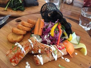 Charcoal bubble waffles with a side of hash browns at Handsome Her in Brunswick
