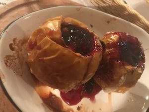 Baked apple with berrie jam and nut filling at Propaganda  in Chisinau