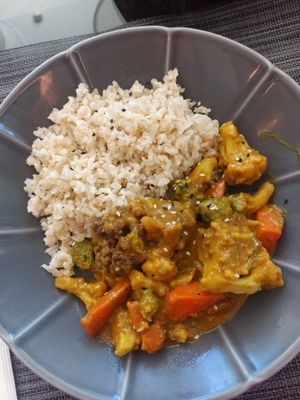 Vegetable curry with wholegrain rice at Organic Caffe in Estoril