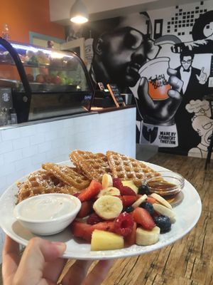 Waffles with fruit, syrup, and coconut cream. at Waffle on Cairns in Cairns