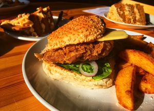 Seitan chicken burger and lotus biscoff cake.  at Vegan All Sorts in Saltaire