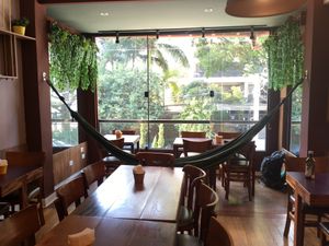 Upstairs seating with a hammock at Hareburger in Sao Paulo