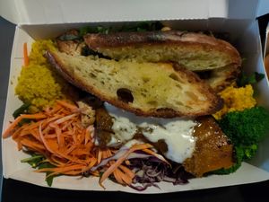 Bli Buddha (lettuce, spinach, arugula, blanched broccoli, carrot, cabbage, roasted pumpkin, cous cous, hummus, grilled tofu, chickpeas, green lentils, vegan salad dressing, bread at Kynd Community - Seminyak in Seminyak