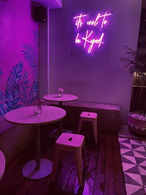 Neon sign in garden  at Kynd Community - Seminyak in Seminyak