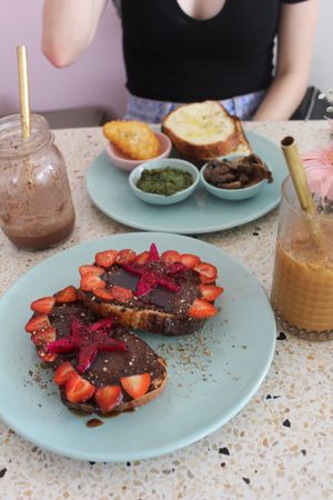 Delicious toasts: one savoury (custom), one sweet (Einstein)! Also pictured is an iced caramel latte (with coconut milk), and an Oreo milkshake! Amazing :) at Kynd Community - Seminyak in Seminyak
