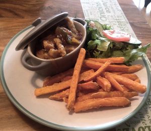 Mango Sweet and Sour Chicken with Sweet Potato Fries   at Green Onions Cafe in West Kirby