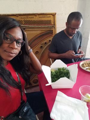Me and my hubby enjoying a little Kale salad and Qui no a stir fry while at EBN's Vegan Cuisine. at EBN's Vegan Cuisine in Charlotte