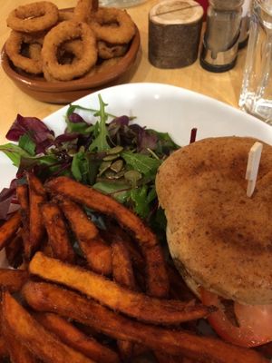 Veggie burger (it was unreal) sweet potato fries, salad and onion rings at Cafe Thrive in Southampton