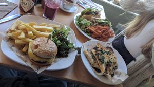 The 'Meaty' Burger (Bottom left) and Very Berry Purple Smoothie (Top left); Garlic Bread (bottom right) and 'TLT' Thrive Sandwich (top right) at Cafe Thrive in Southampton