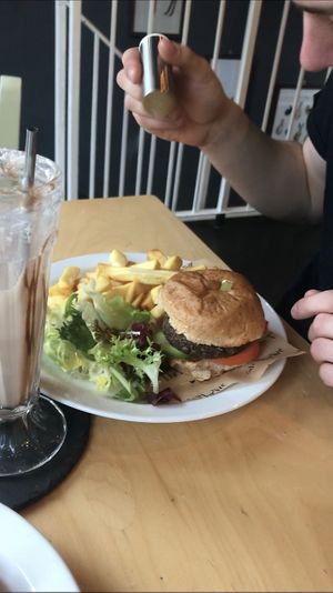 Lentil burger with chips and milkshake at Cafe Thrive in Southampton