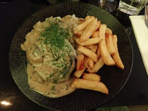 Grilled Seitan Steak with Garlic Rice, triple cooked Chips and a rich Mushroom Coffee Cream Sauce at Veginity in Dublin