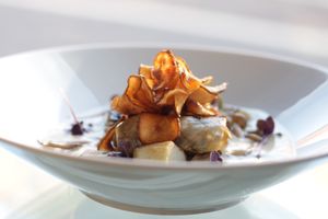 Paris Brown Mushroom Rolls, Garlic-Thyme Jerusalem Artichokes, Cauliflower Volute, Basil Oil, Artichoke Crisps and pickled Shimeji Mushrooms at Veginity in Dublin