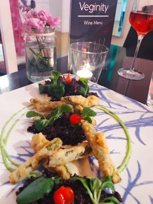 Panko asparagus and watercress, black tay berry rice, Dijon mustard béchamel, garlic paste and pickled beak pepper at Veginity in Dublin