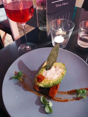 Steamed avocado with crispy tofu smoked bacon, almond cream cheese with spicy harissa sauce and sage.  at Veginity in Dublin