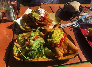 Vegan taquitos up front and vegan nachos in the background at Trippy Taco in Fitzroy