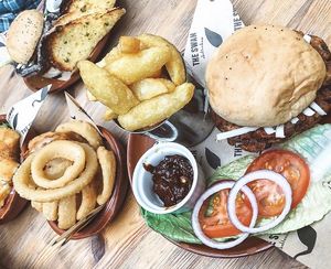 Veggie burger with cheese, fries, onion rings & garlic bread at The Swan in Cheltenham
