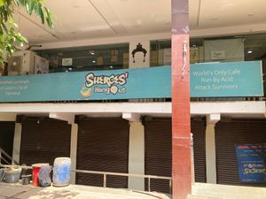 Staircase to the right leads up to the restaurant.  at Sheroes Hangout in Agra
