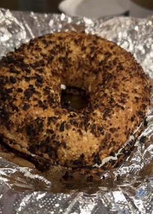 Onion bagel with vegan cream cheese  at White Electric Coffee in Providence