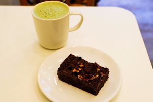 Fudge brownie and matcha latte. at Comptoir Veggie in Paris