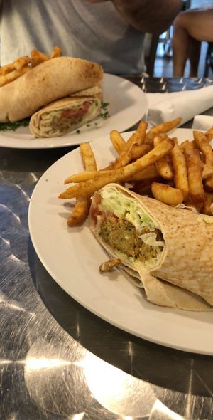 Falafel sandwich and eggplant sandwich with fries at Sammy's Mediterranean Cafe in Vero Beach
