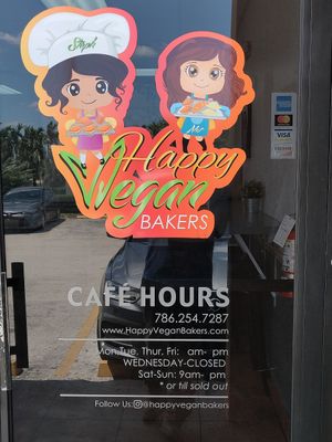 Information on the door. at The Happy Vegan Bakers in Hialeah