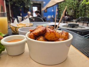 Spicy baked potatoes with Chipotle sauce at Tacogreen in Queretaro