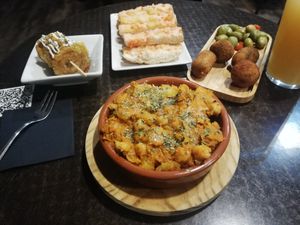 Croquettes, tostodos, squash & chickpea dish at La Cerveseria Clandestina in Barcelona