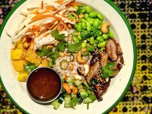 ASIAN RICE BOWL - brown rice, shitake mushrooms, edamame beans, spring onion, pickled cabbage, mango, cashews, carrot and coriander with a ginger and soy dressing. at Project Social in Ibiza
